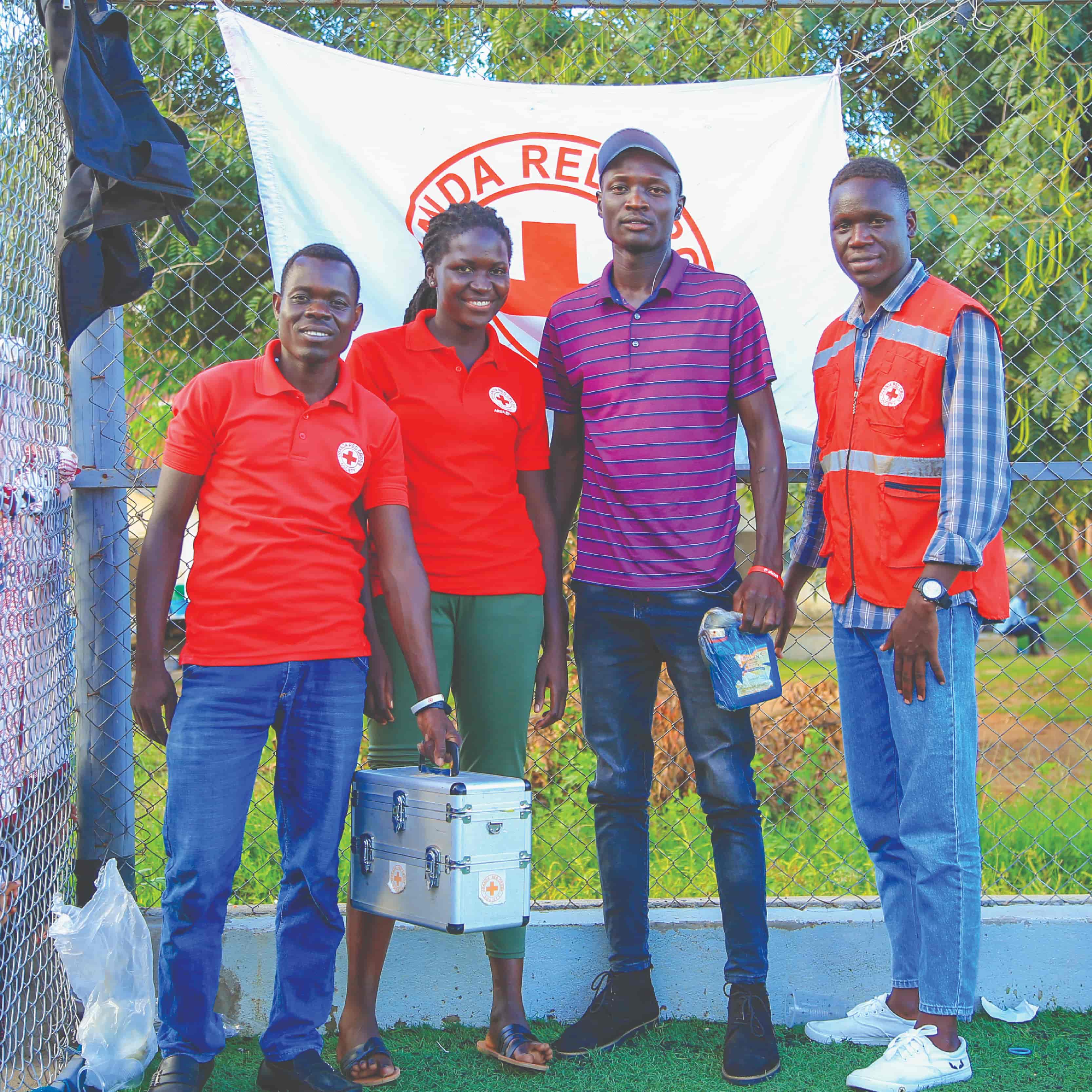 Image of three soccer fans standing